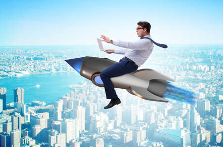Businessman flying on rocket in business concept