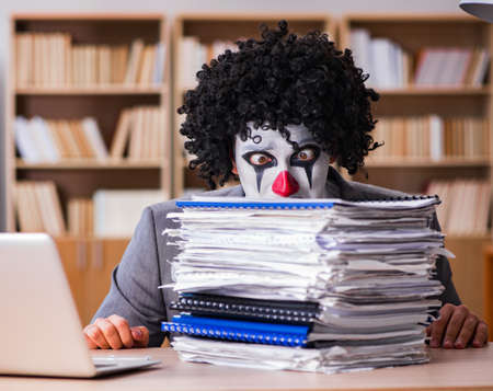 Clown businessman working in the officeの写真素材