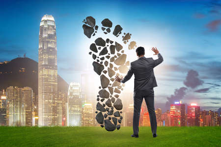 The carbon footprint concept with businessmanの写真素材