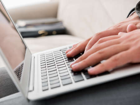 The businessman working with laptop in business concept