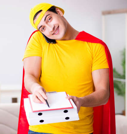 Superhero pizza delivery guy with red coverの写真素材
