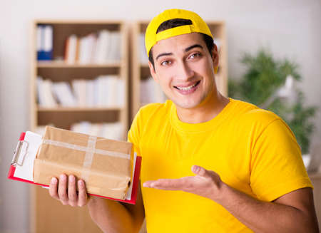 Delivery man delivering parcel boxの写真素材