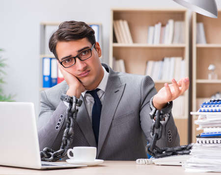 Handsome businessman working in the officeの写真素材