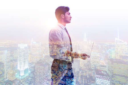 Successful businessman against cityscape in business concept