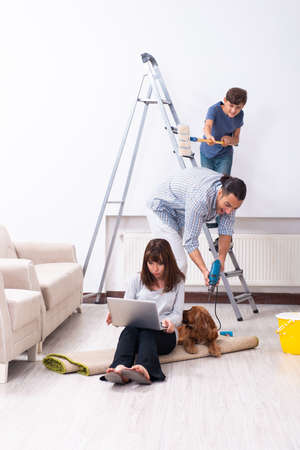 Young family doing home renovationの写真素材