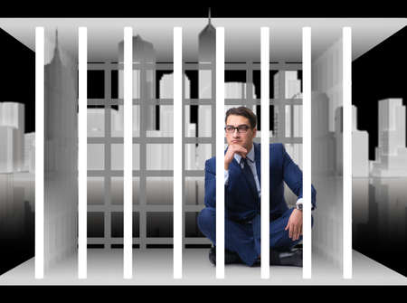 Businessman in the cage business conceptの写真素材