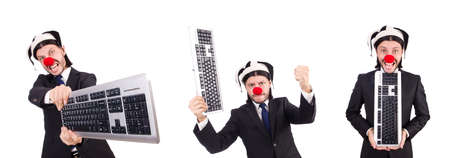 Funny clown with keyboard isolated on whiteの写真素材