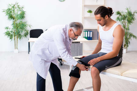Young male patient visiting experienced doctor