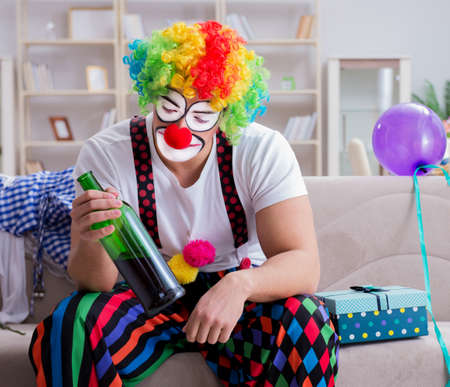 Drunk clown celebrating having a party at home