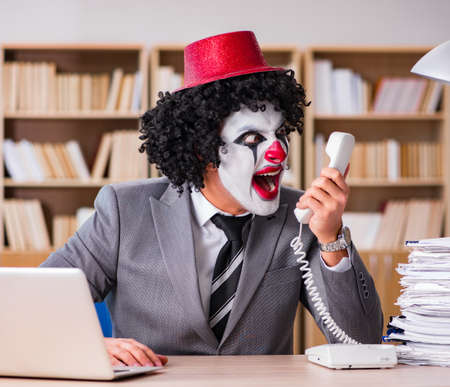 Clown businessman working in the office
