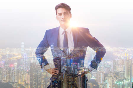 Successful businessman against cityscape in business concept
