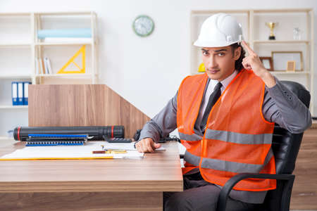 Young male architect working in the officeの写真素材