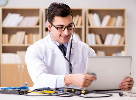 IT technician repairing broken laptop notebook computer
