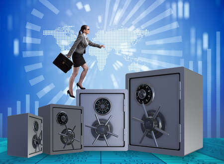 Businesswoman walking on top of safeの写真素材