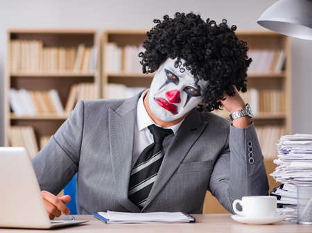 Clown businessman working in the officeの写真素材