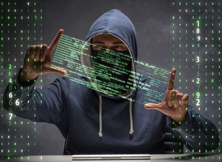 Young hacker in data security concept