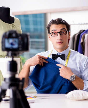 Young man working as fashion video bloggerの写真素材