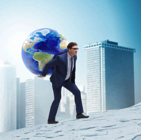 Businessman carrying Earth on his shoulders