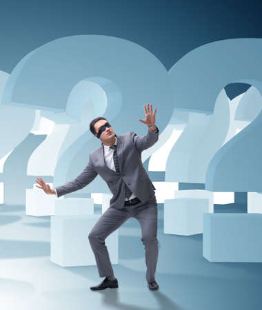 Blindfold businessman in incertainty conceptの写真素材