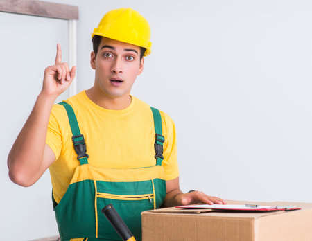 Transportation worker delivering boxes to house