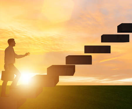 Businessman in career promotion concept with stairs