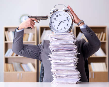 Businessman struggling to meet challenging deadlines
