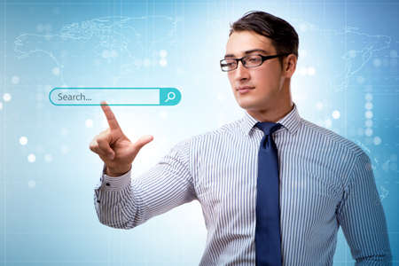 Search concept with businessman pressing buttonの写真素材