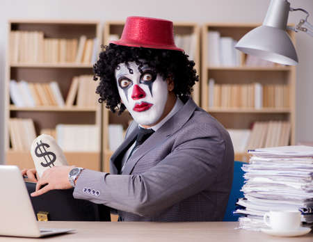 Clown businessman working in the officeの写真素材