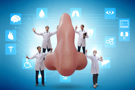 Doctors doing plastic nose surgeryの写真素材