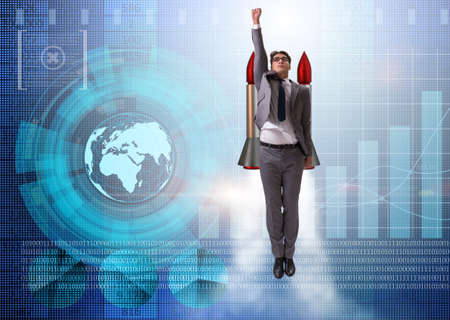 Businessman flying with rocket in funny business conceptの写真素材