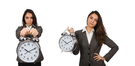 Businesswoman with clock missing her deadlinesの写真素材