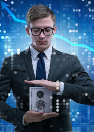 Businessman in security concept with safeの写真素材