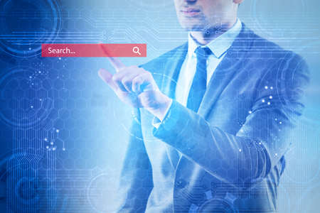 Search concept with the businessman pressing button