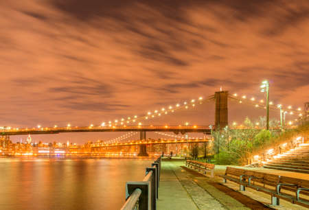 The night view of manhattan and brooklyn bridgeの写真素材