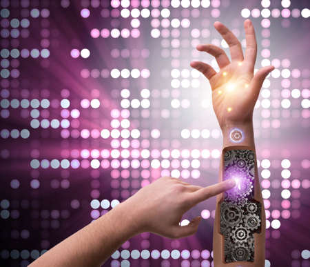 The robotic hand pressing button in futuristic conceptの写真素材