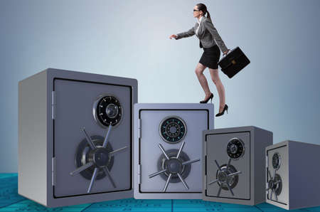 Businesswoman walking on top of safeの写真素材