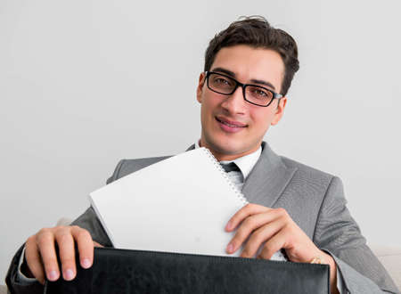 Businessman with briefcase in business concept