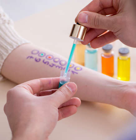 The doctor testing allergy reaction of patient in hospital