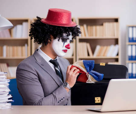 Clown businessman working in the officeの写真素材