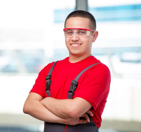 Young furniture carpenter in industrial concept