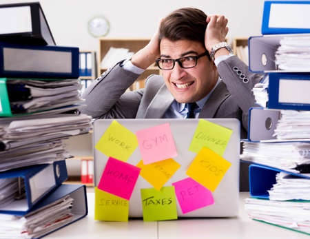 Businessman struggling with multiple priorities