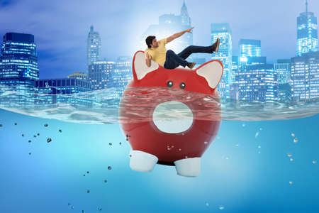 Student debt concept with piggybank and studentの写真素材