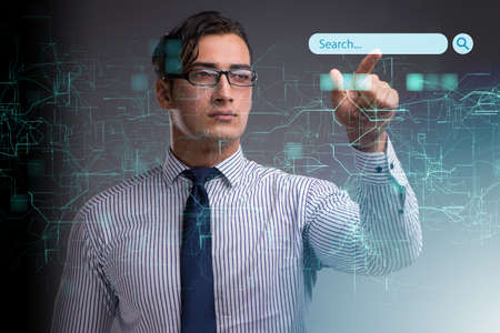 Search concept with businessman pressing buttonの写真素材