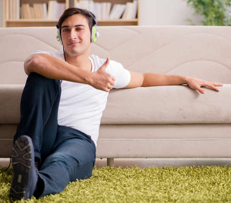 Handsome man listening to the musicの写真素材