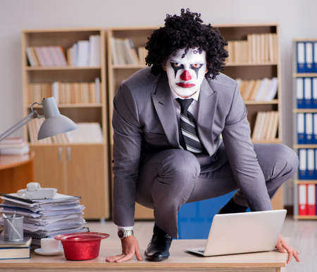 Clown businessman working in the officeの写真素材