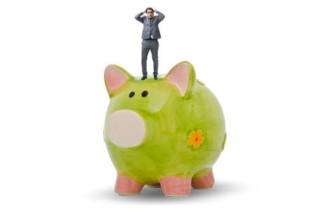 Businessman in debt concept with piggybankの写真素材