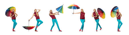 Young woman with colourful umbrella isolated on whiteの写真素材