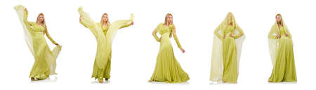 The young woman in elegant long green dress isolated on whiteの写真素材