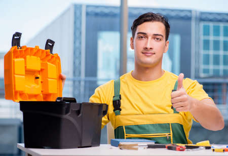 Construction worker sitting at the desk