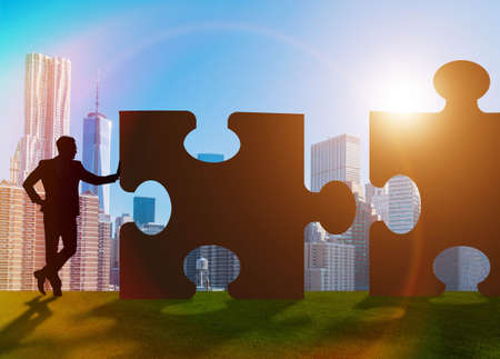 Business concept of teamwork with jigsaw puzzleの写真素材